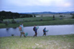 Biologists and volunteer head for the lake